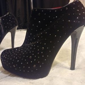 Black ankle boots with studs